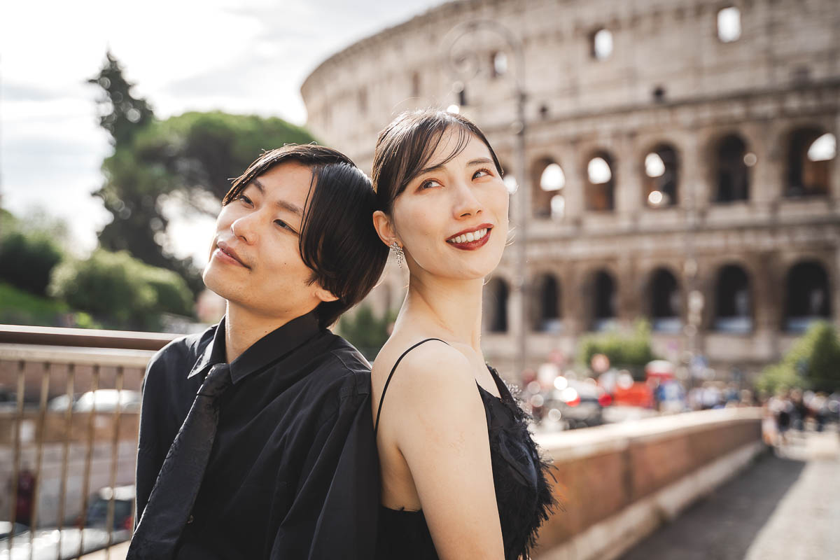 a man and woman cool smile pose at colosseum