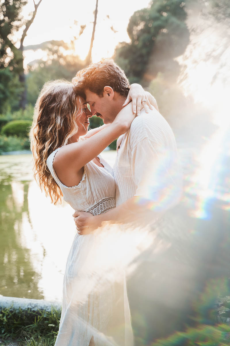 a man and woman hugging in Villa Borghese