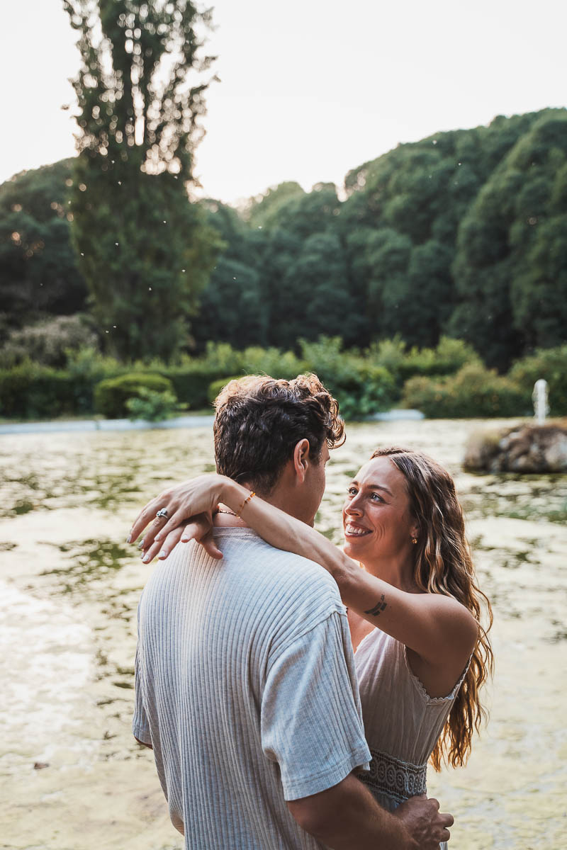 a man and woman hugging at villa borghese